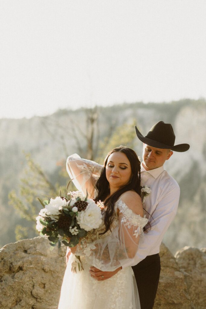 Plan your dream elopement in Yellowstone! Breathtaking views at Artist Point and stunning memories captured by our photographers await you! 