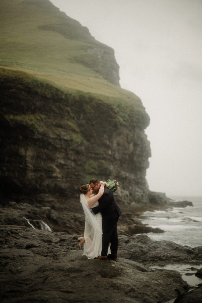 how to elope in Faroe Islands. Kalsoy Island next to the "Woman of the Sea" statue