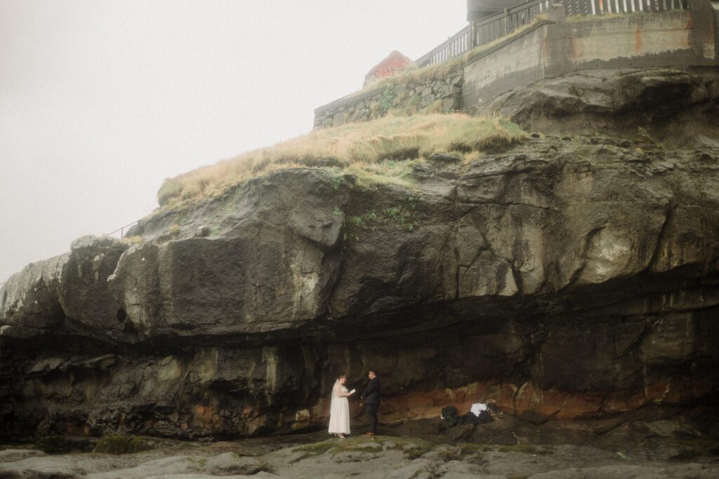 how to elope in Faroe Islands. Kalsoy Island next to the "Woman of the Sea" statue