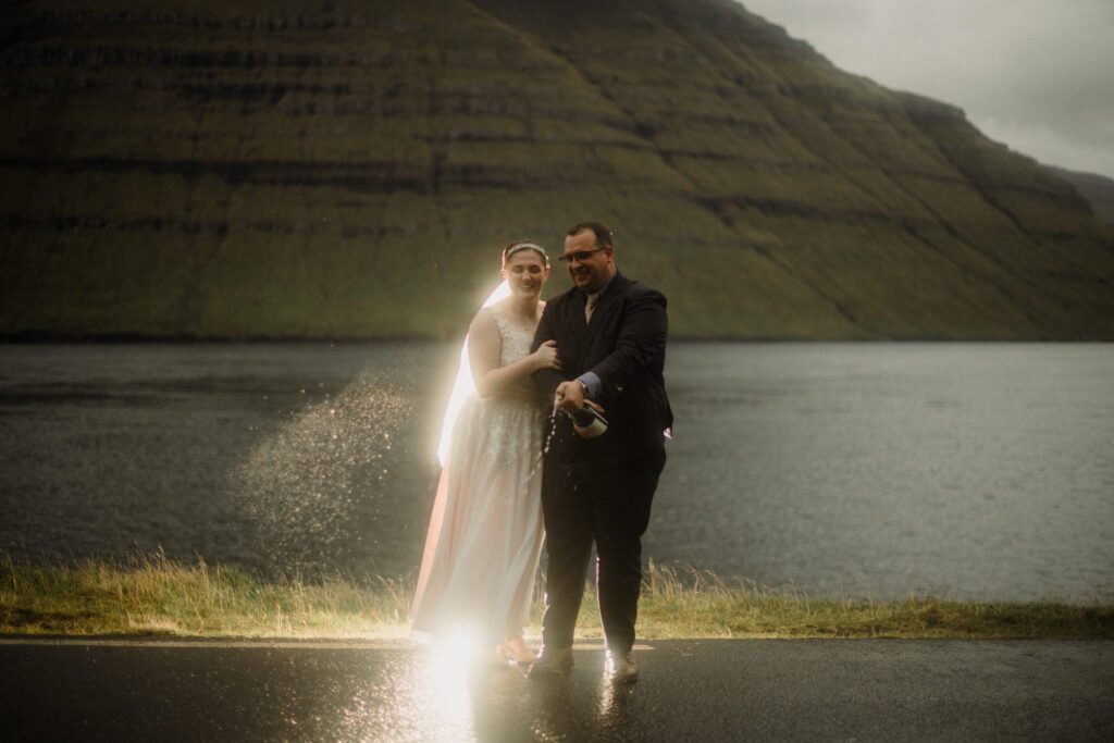 An unforgettable Faroe Islands elopement! Spontaneous vows, stunning cliffs, local traditions and stormy star photos at Saksun. Wedding ceremony at the Sea Woman statue in Kalsoy. 