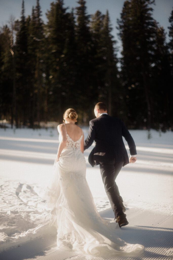 An adventurous winter elopement in Montana features frozen waterfalls, ski lifts, reindeer, and stunning star photos. Explore their epic day! Get more info on Where to stay in Big Sky Resort!