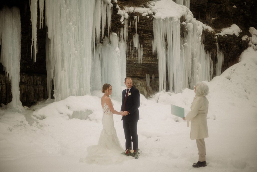 An adventurous winter elopement in Montana features frozen waterfalls, ski lifts, reindeer, and stunning star photos. Explore their epic day! Get more info on Where to stay in Big Sky Resort!