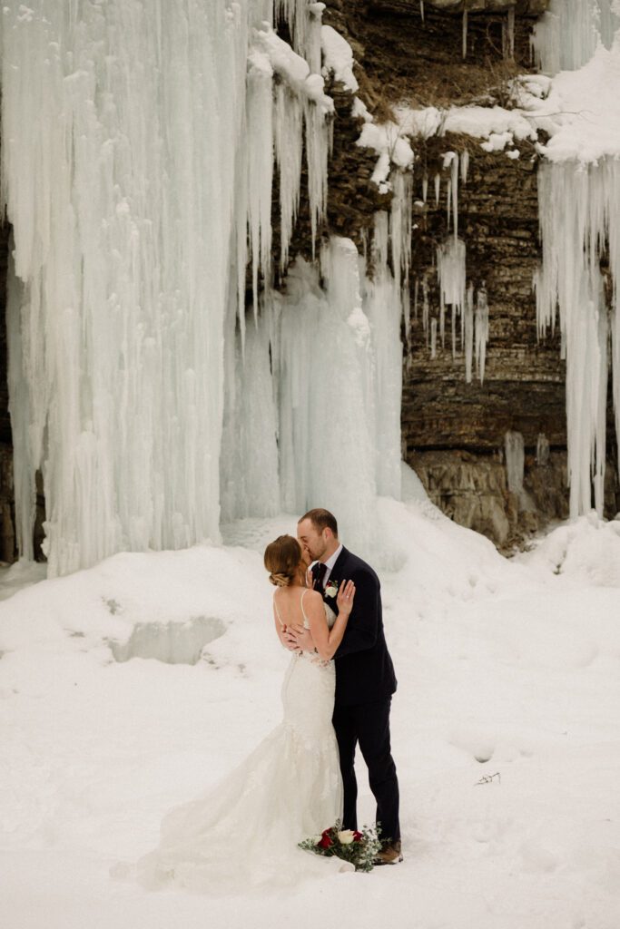 An adventurous winter elopement in Montana features frozen waterfalls, ski lifts, reindeer, and stunning star photos. Explore their epic day! Get more info on Where to stay in Big Sky Resort!