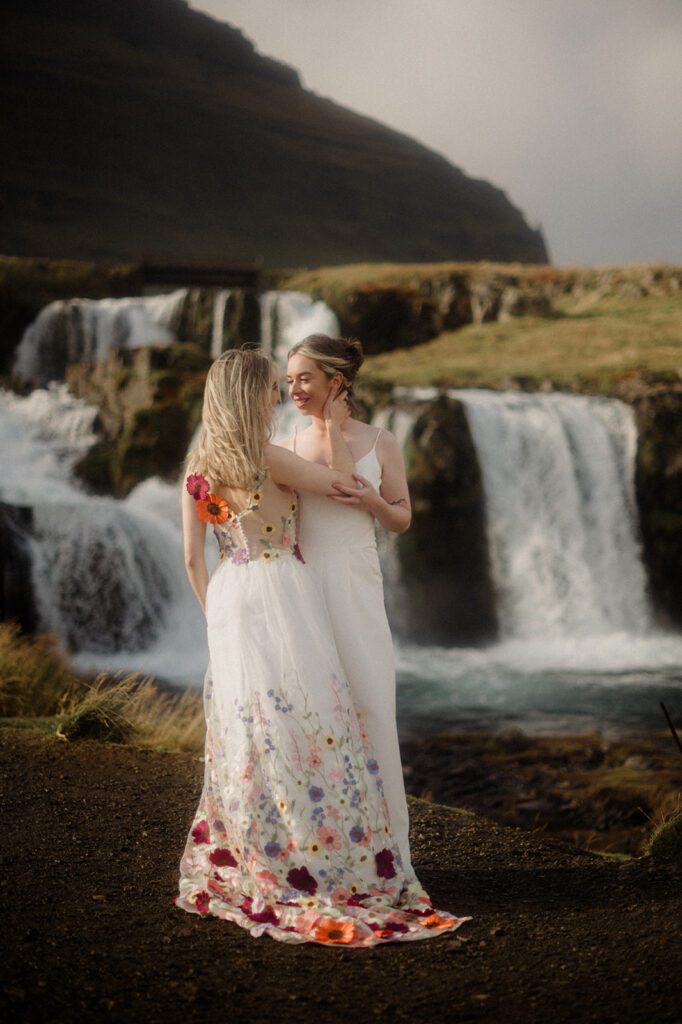 Top Elopement Destinations, Iceland. Queer Elopement on the Snaefellsness Peninsula. Queer couple in front of Iceland waterfall.