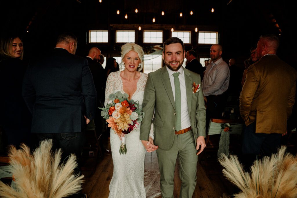 It's magic for this winter wedding in Bozeman at Firelight Farm. Cozy vibes, a champagne tower, and western charm!