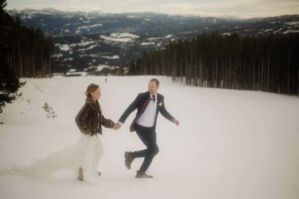 An adventurous winter elopement in Montana features frozen waterfalls, ski lifts, reindeer, and stunning star photos. Explore their epic day! Get more info on Where to stay in Big Sky Resort!