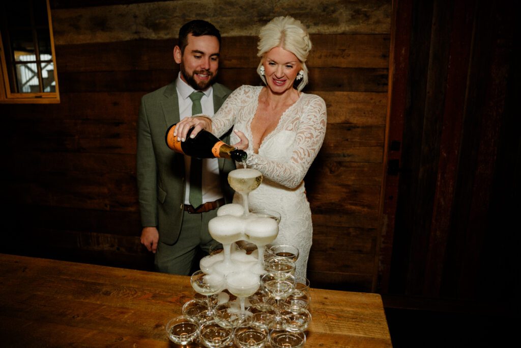 It's magic for this winter wedding in Bozeman at Firelight Farm. Cozy vibes, a champagne tower, and western charm!