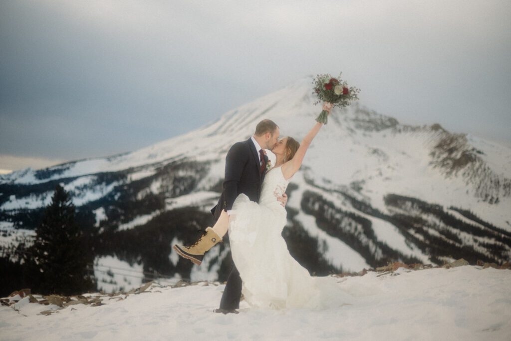 An adventurous winter elopement in Montana features frozen waterfalls, ski lifts, reindeer, and stunning star photos. Explore their epic day! Get more info on Where to stay in Big Sky Resort!