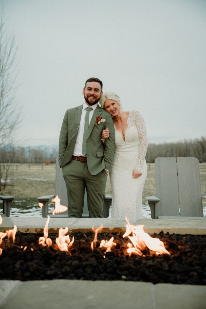 It's magic for this winter wedding in Bozeman at Firelight Farm. Cozy vibes, a champagne tower, and western charm!