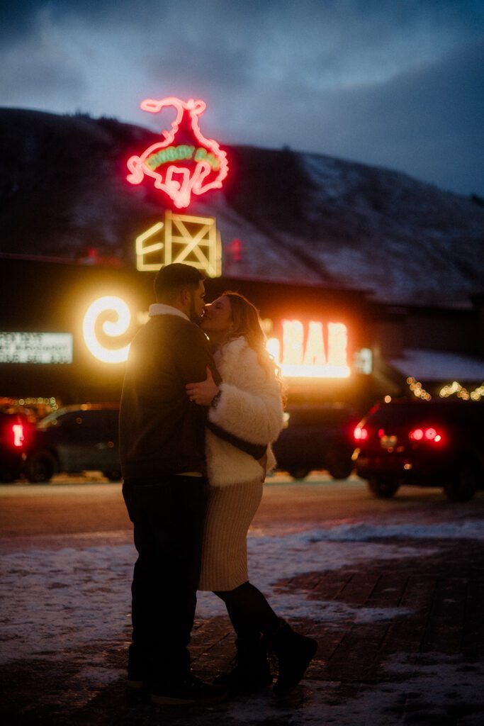 Proposal in Grand Teton. Couple celebrating after outside the Country Bar in Jackson Hole, Wyoming.