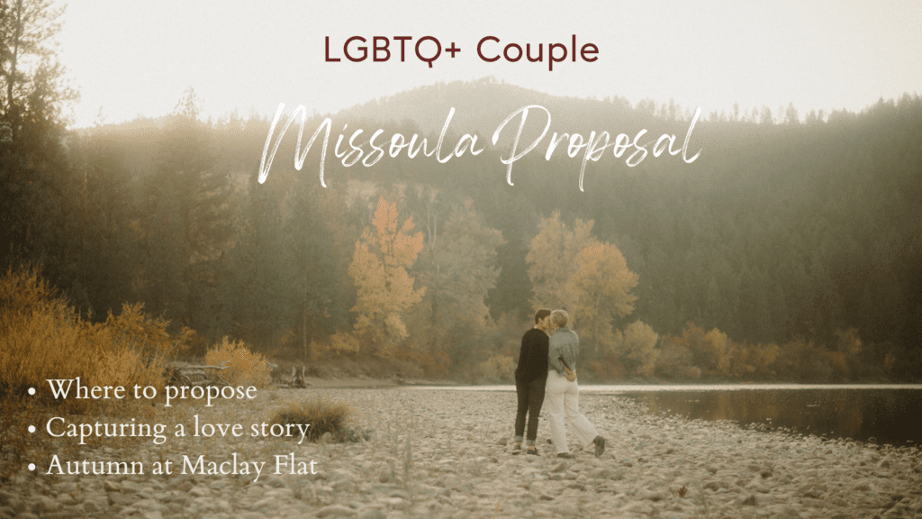 Lesbian Proposal in Missoula: Maclay Flat in Autumn. Photo of two women kissing after getting engaged. On the rocky shore line with trees surrounding them. 