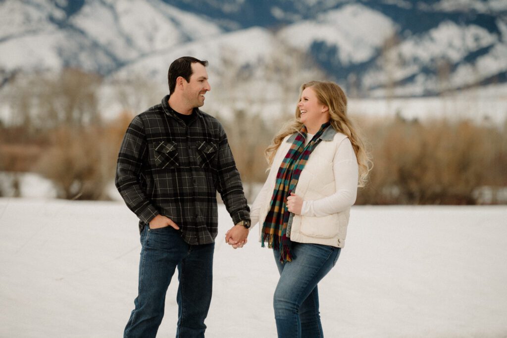 Experience the magic of a winter Bozeman Montana engagement with epic mountains, major Western vibes, and champagne pops.