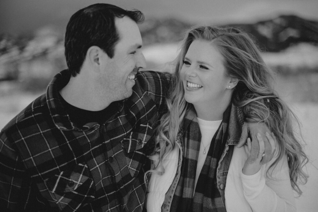 Experience the magic of a winter Bozeman Montana engagement with epic mountains, major Western vibes, and champagne pops.