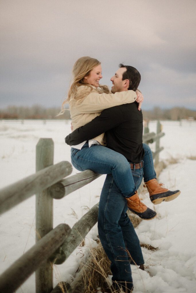 Experience the magic of a winter Bozeman Montana engagement with epic mountains, major Western vibes, and champagne pops.