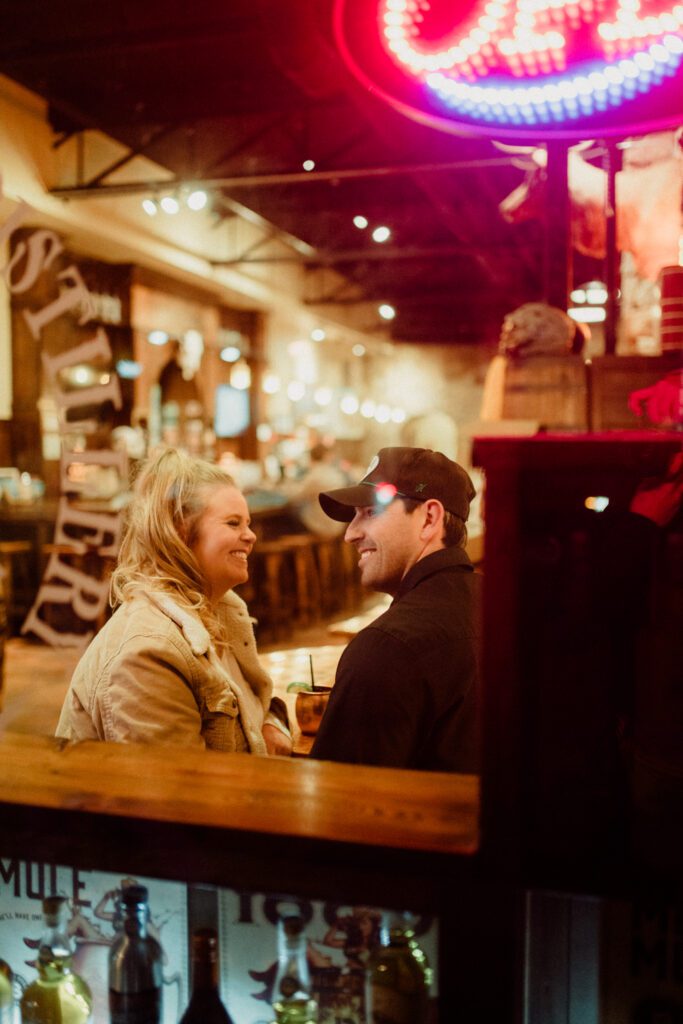 Experience the magic of a winter Bozeman Montana engagement with epic mountains, major Western vibes, and champagne pops.