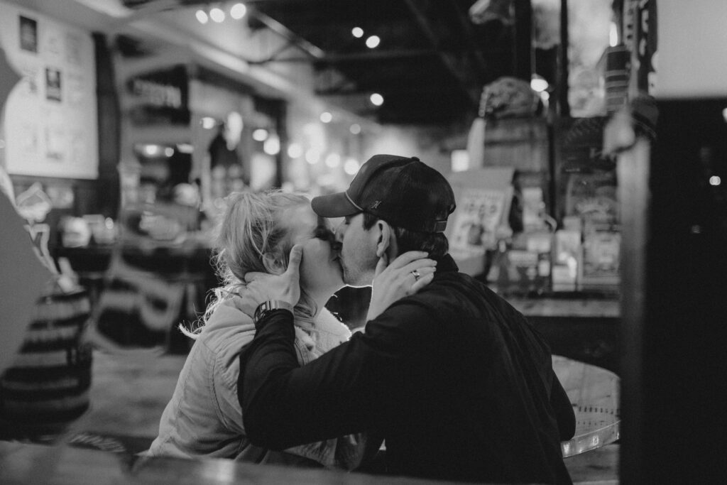 Experience the magic of a winter Bozeman Montana engagement with epic mountains, major Western vibes, and champagne pops.