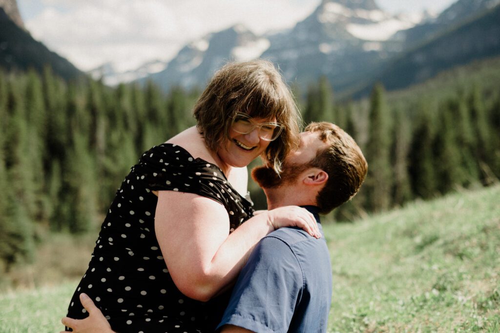 Couple laughing during engagement photos in Bozeman at Hyalite Canyon