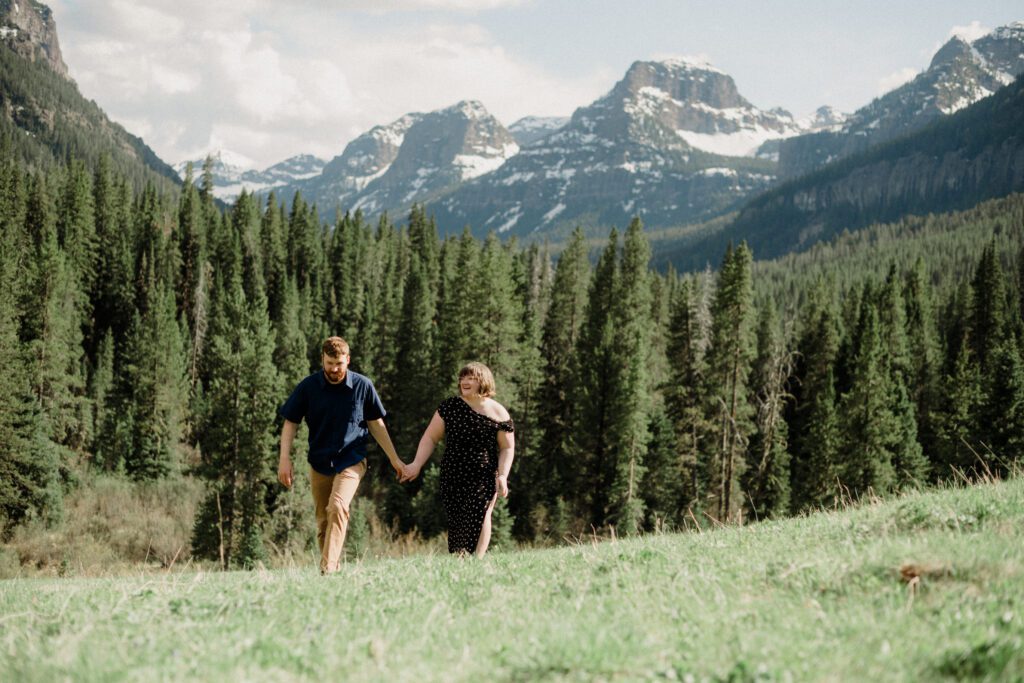 Couple laughing during engagement photos in Bozeman at Hyalite Canyon