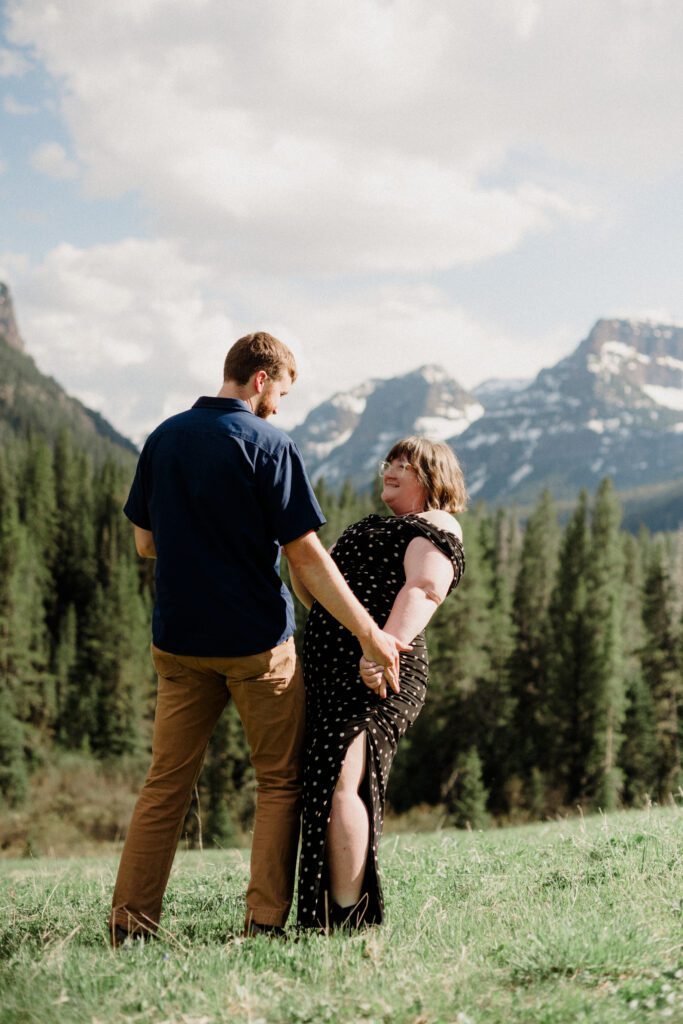 Couple laughing during engagement photos in Bozeman at Hyalite Canyon
