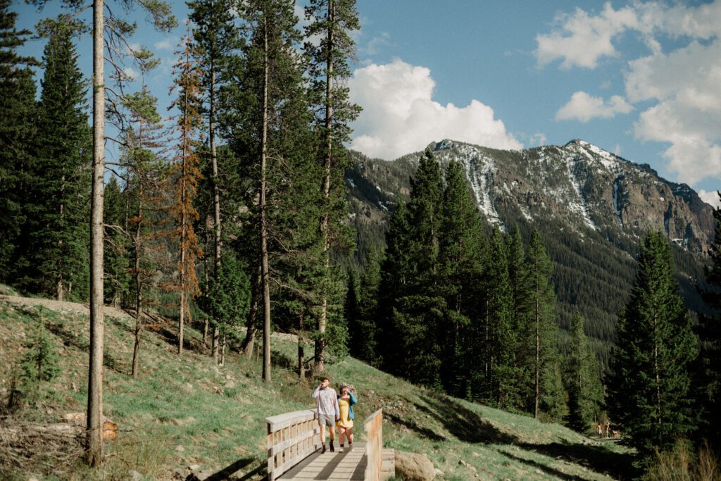 Couple laughing during engagement photos in Bozeman at Hyalite Canyon