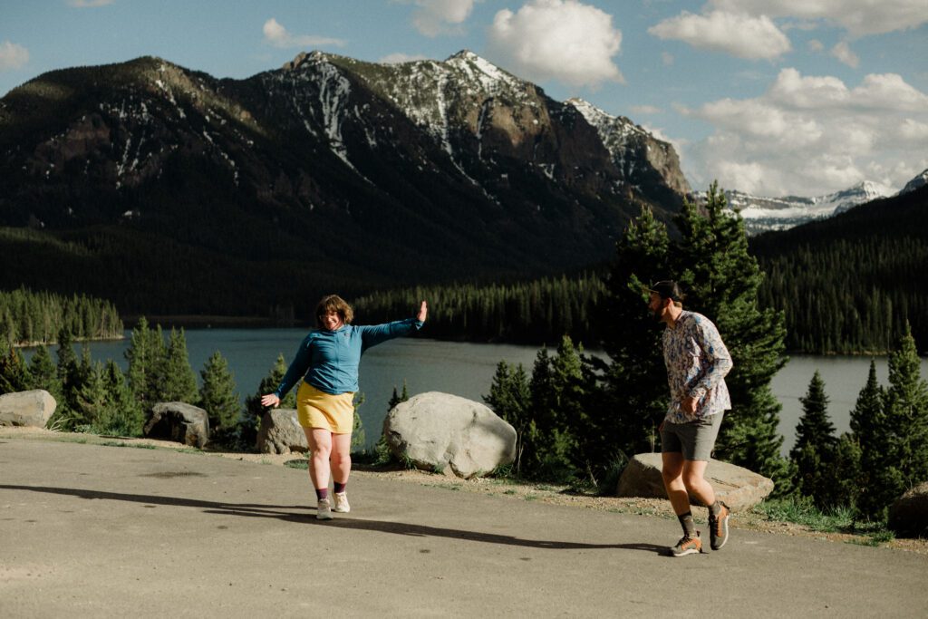 Couple laughing during engagement photos in Bozeman at Hyalite Canyon