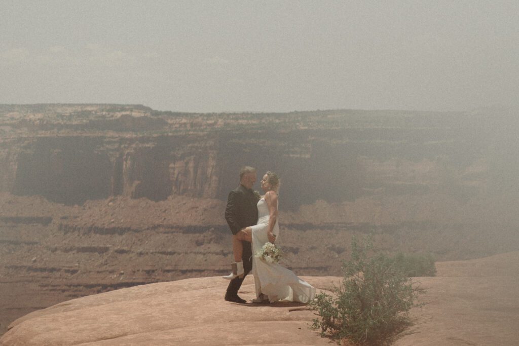 moab elopement, dirt bike wedding, desert elopement dirt bike photo, adventure elopement moab images, moab elopement photographer, ceremony at dead horse point state park