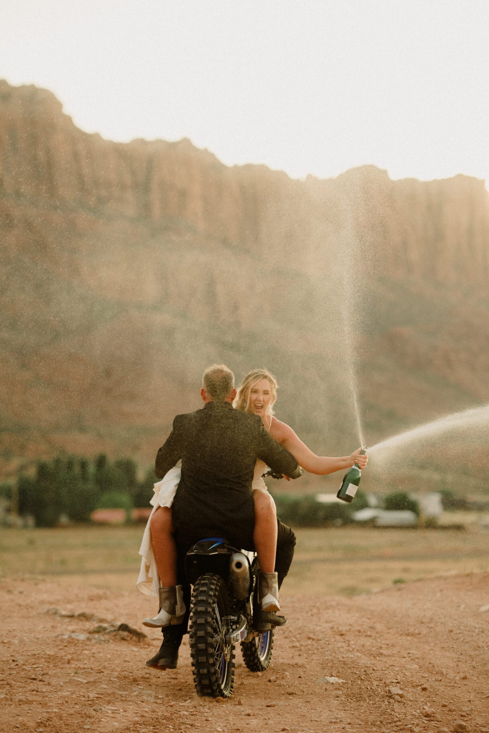 moab elopement, dirt bike wedding, desert elopement dirt bike photo, adventure elopement moab images, moab elopement photographer, ceremony at dead horse point state park