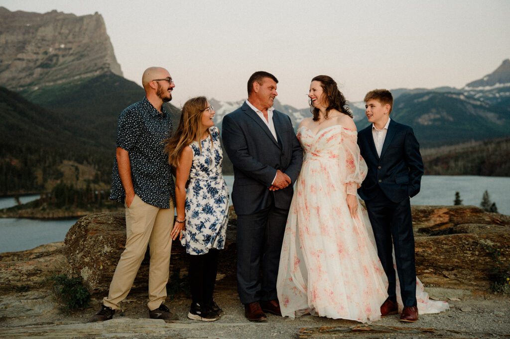 Sun Point Micro Wedding! Photo of bride and groom with close family.