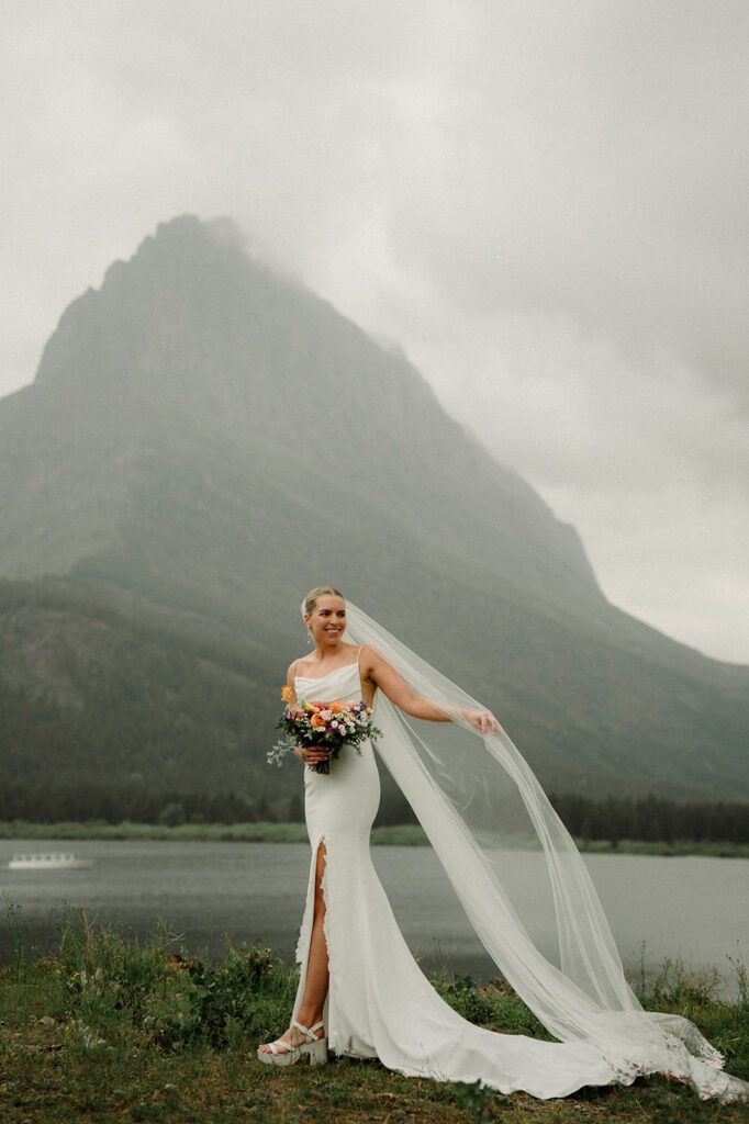 This rain filled National Park wedding in Glacier what dreams are made of! Includes tunnel photos, Going-to-the-Sun road, and Many Glacier hotel ceremony. 