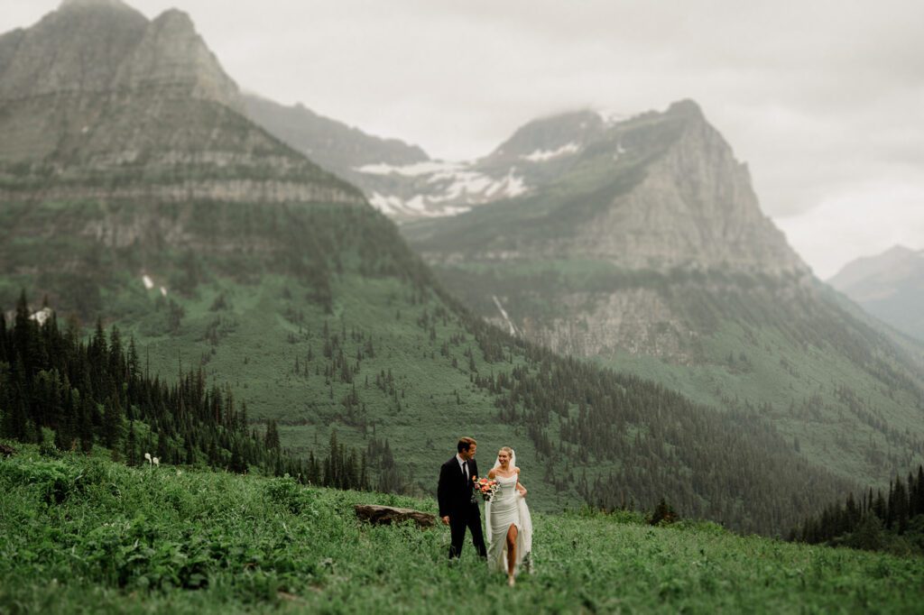 This rain filled National Park wedding in Glacier what dreams are made of! Includes tunnel photos, Going-to-the-Sun road, and Many Glacier hotel ceremony. 