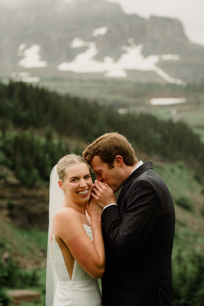 This rain filled National Park wedding in Glacier what dreams are made of! Includes tunnel photos, Going-to-the-Sun road, and Many Glacier hotel ceremony. 