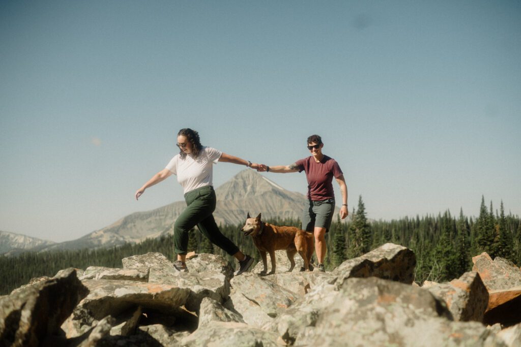 K&S's Montana hiking engagement session in Big Sky —wildflowers, adventure vibes, and pup cameos included!