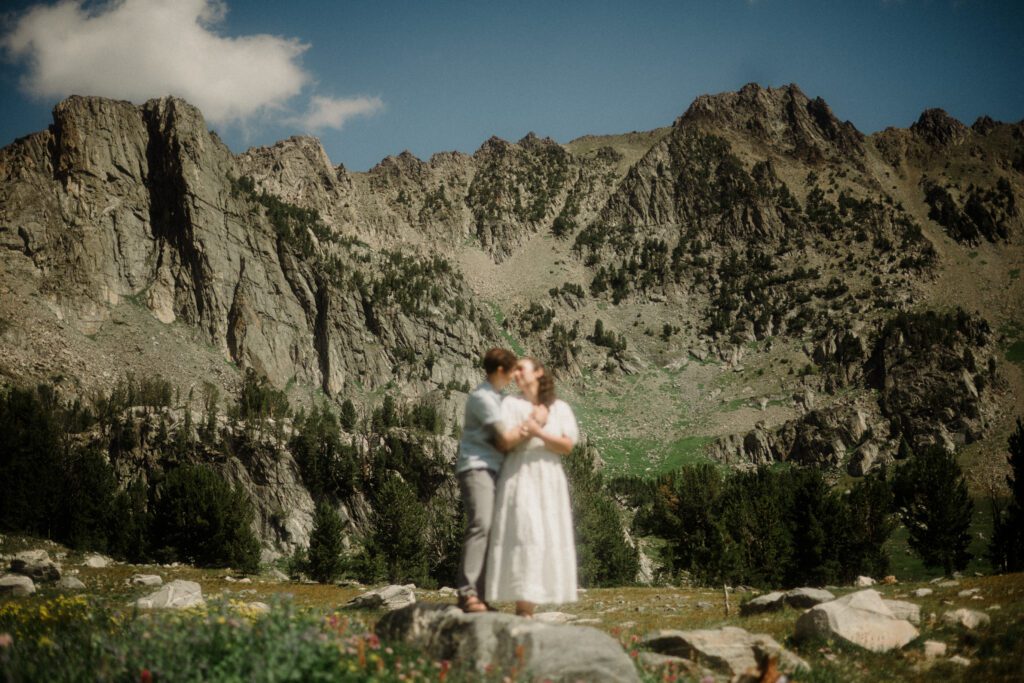 K&S's Montana hiking engagement session in Big Sky —wildflowers, adventure vibes, and pup cameos included!