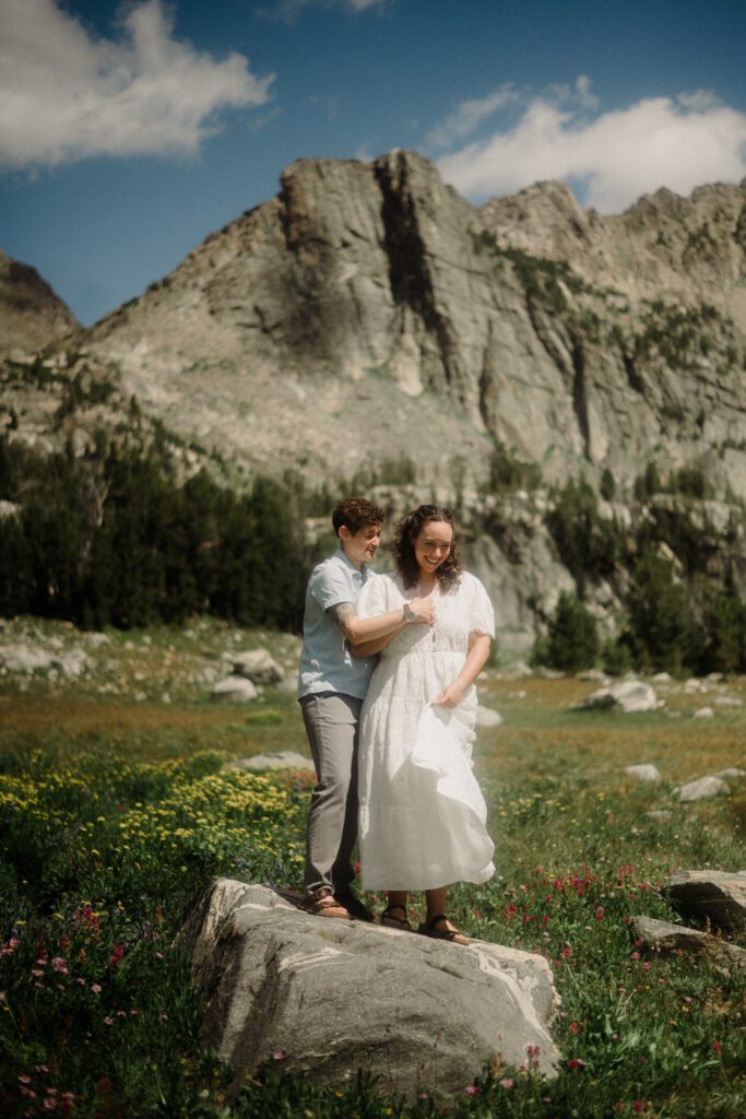 K&S's Montana hiking engagement session in Big Sky —wildflowers, adventure vibes, and pup cameos included!