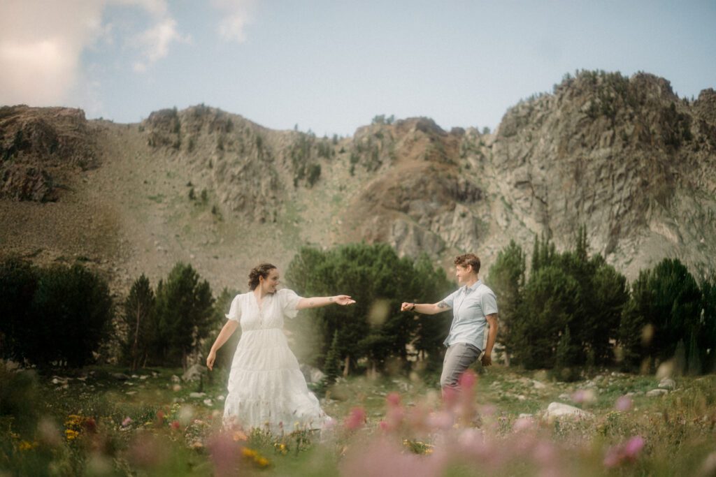 K&S's Montana hiking engagement session in Big Sky —wildflowers, adventure vibes, and pup cameos included!