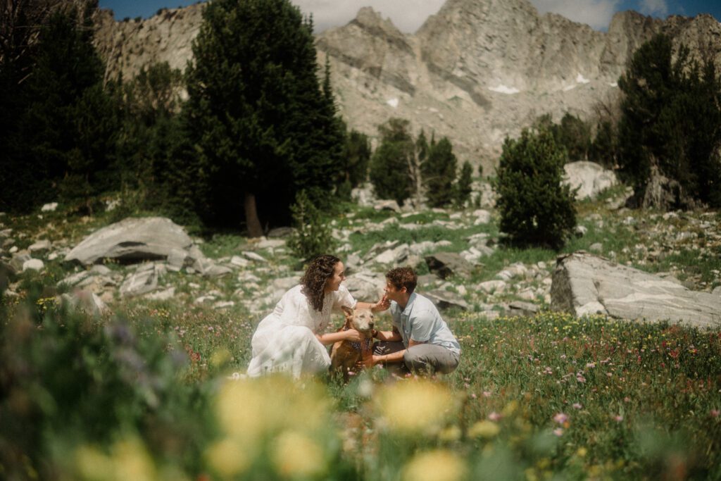 K&S's Montana hiking engagement session in Big Sky —wildflowers, adventure vibes, and pup cameos included!
