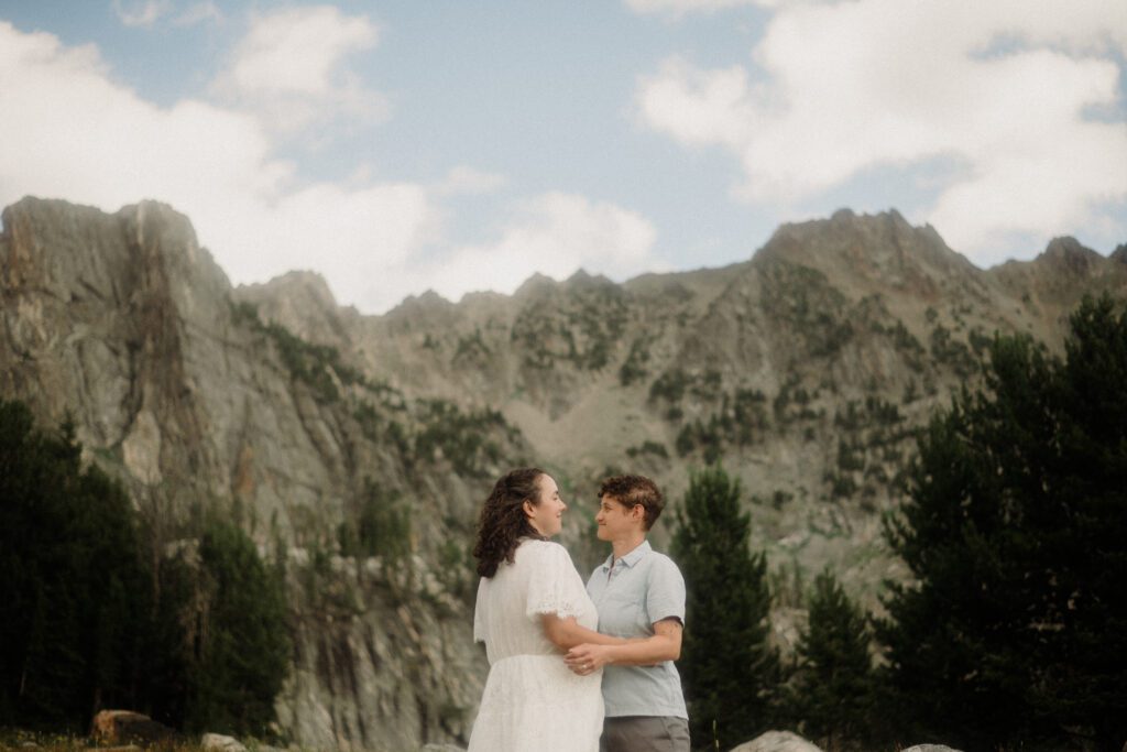 K&S's Montana hiking engagement session in Big Sky —wildflowers, adventure vibes, and pup cameos included!