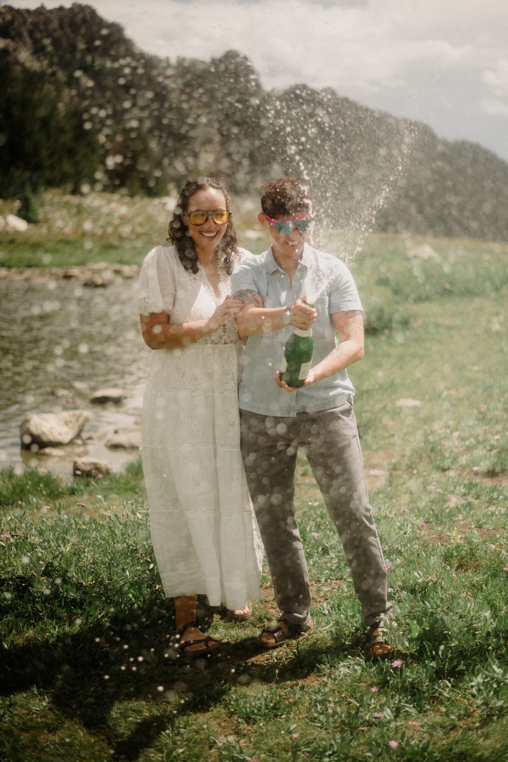K&S's Montana hiking engagement session in Big Sky —wildflowers, adventure vibes, and pup cameos included!