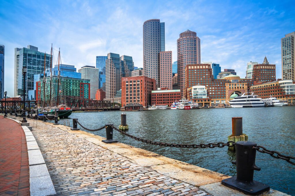Boston harbor and cityscape skyline view, Massachusetts, USA. The top 5 LGBTQ+ Wedding Destinations in the U.S. include Boston, Hudson Valley, San Francisco, National Parks and MORE!