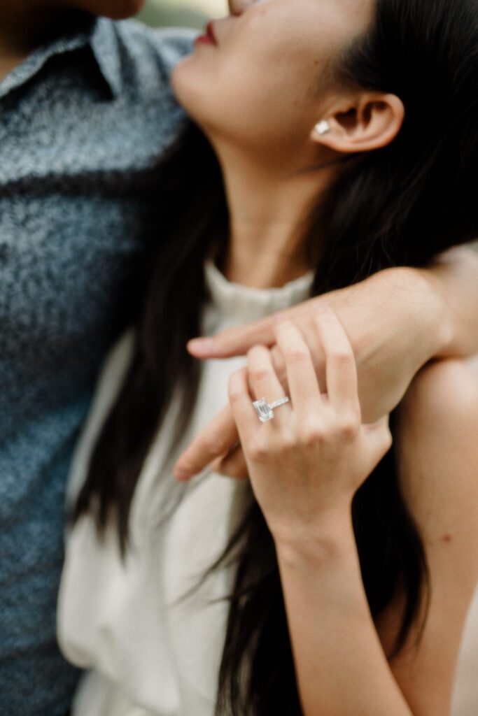 Square-cut diamond engagement ring sparkling in the Montana sun