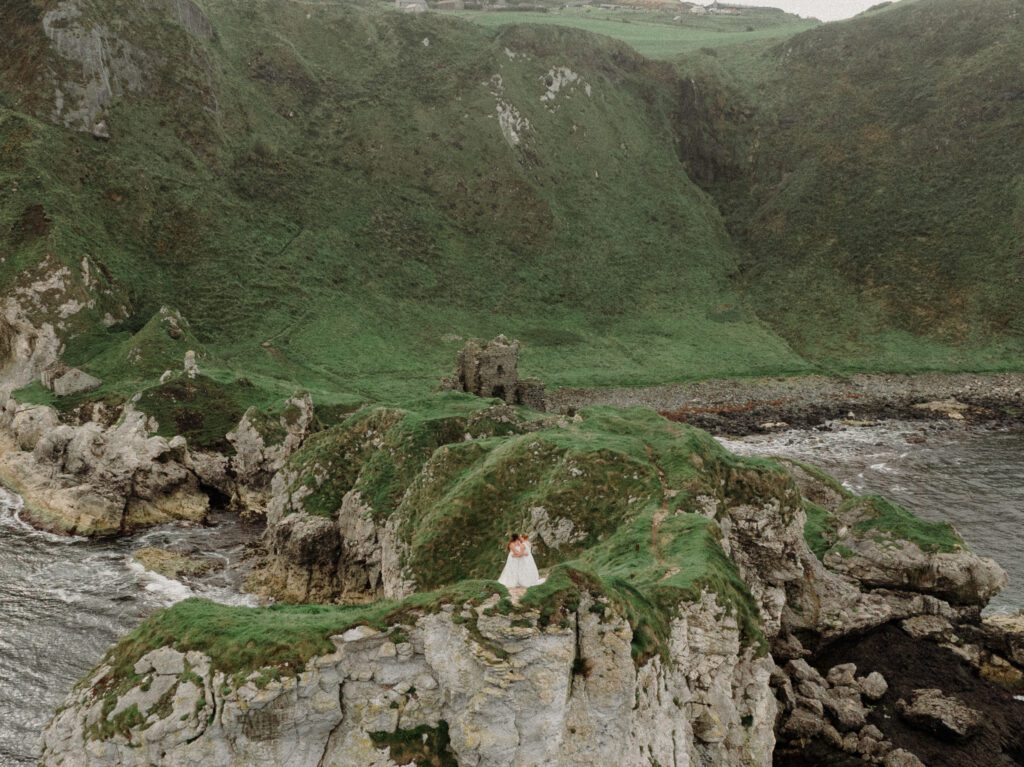 Northern Ireland elopement with epic locations like Kinbane Castle, Ballintoy Harbor and Giant's Causeway! LGBTQ+ wedding photographer takes Debbie & Kirstie on an epic adventure in Northern Ireland!