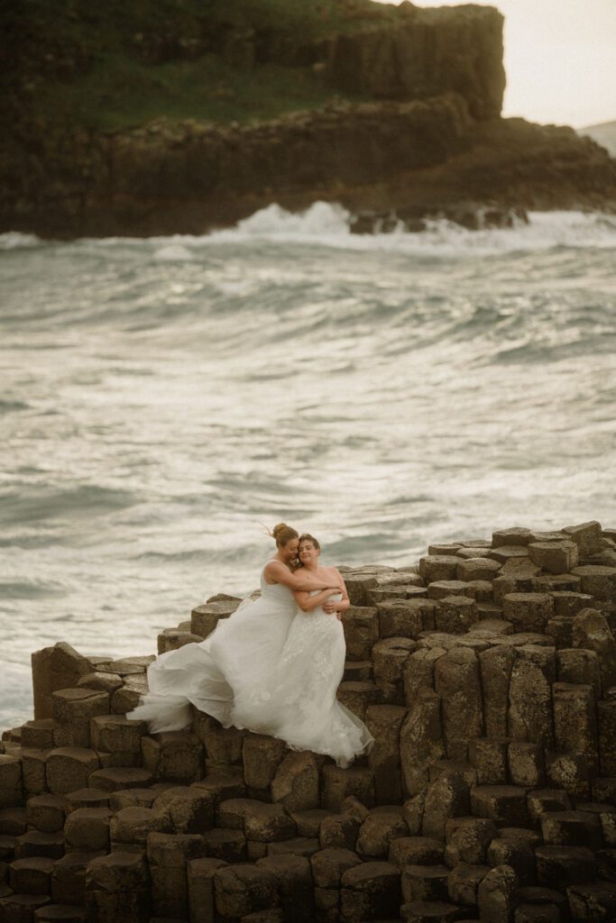 Northern Ireland elopement with epic locations like Kinbane Castle, Ballintoy Harbor and Giant's Causeway! LGBTQ+ wedding photographer takes Debbie & Kirstie on an epic adventure in Northern Ireland!
