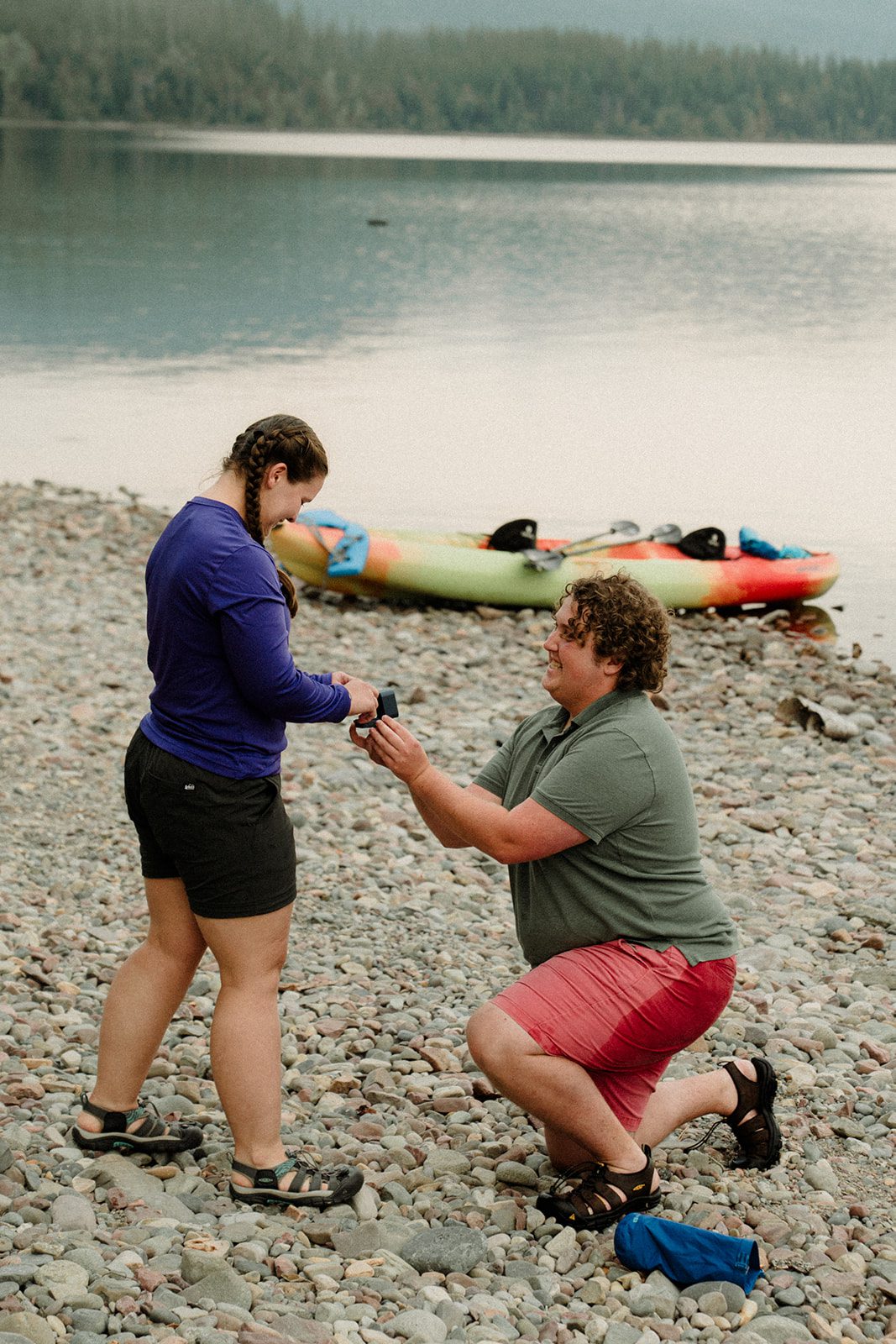 kayak proposal on Montana lake with man proposing to woman.