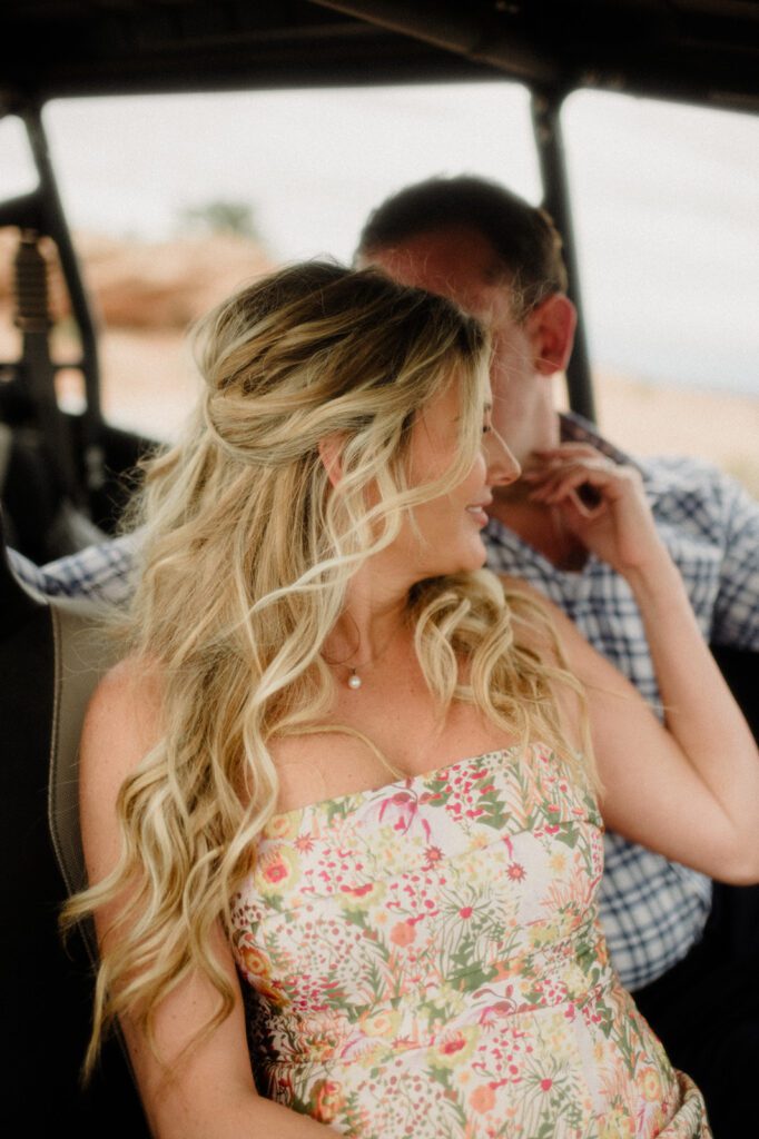 Adventure Session in Moab with bride and groom exploring in an ATV. ATV wedding photos.