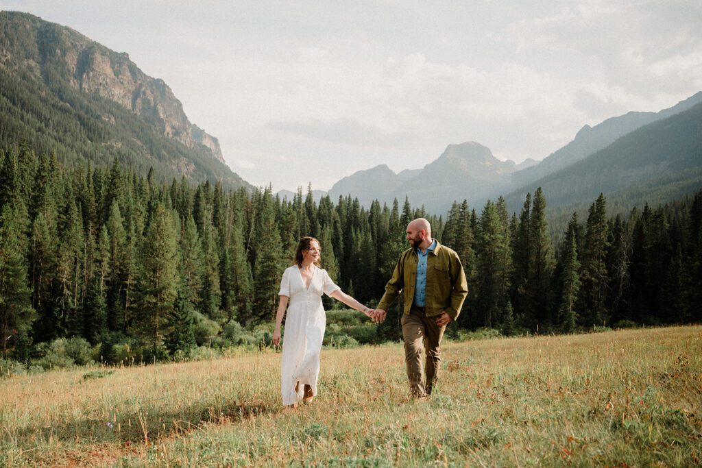 Hyalite Canyon Engagement Session with epic mountain views, lake magic, dog-friendly trails, and a hilarious Halloween ghost twist. Fun, real,  SO Bozeman. 