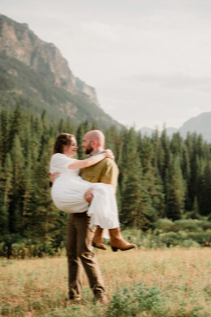 Hyalite Canyon Engagement Session with epic mountain views, lake magic, dog-friendly trails, and a hilarious Halloween ghost twist. Fun, real,  SO Bozeman. 