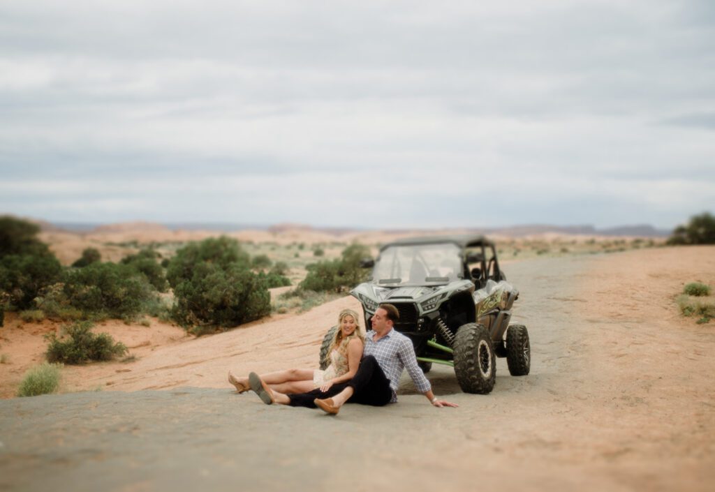Adventure Session in Moab with bride and groom exploring in an ATV. ATV wedding photos.