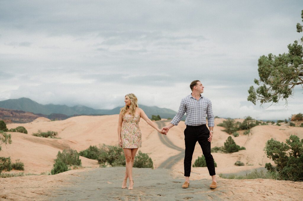 Adventure Session in Moab with bride and groom exploring in an ATV. ATV wedding photos. The best of 2025 Elopement & Wedding Photography.