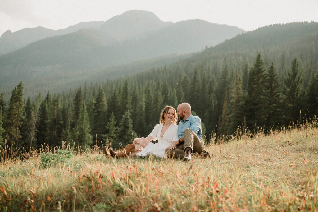 Hyalite Canyon Engagement Session with epic mountain views, lake magic, dog-friendly trails, and a hilarious Halloween ghost twist. Fun, real,  SO Bozeman. 