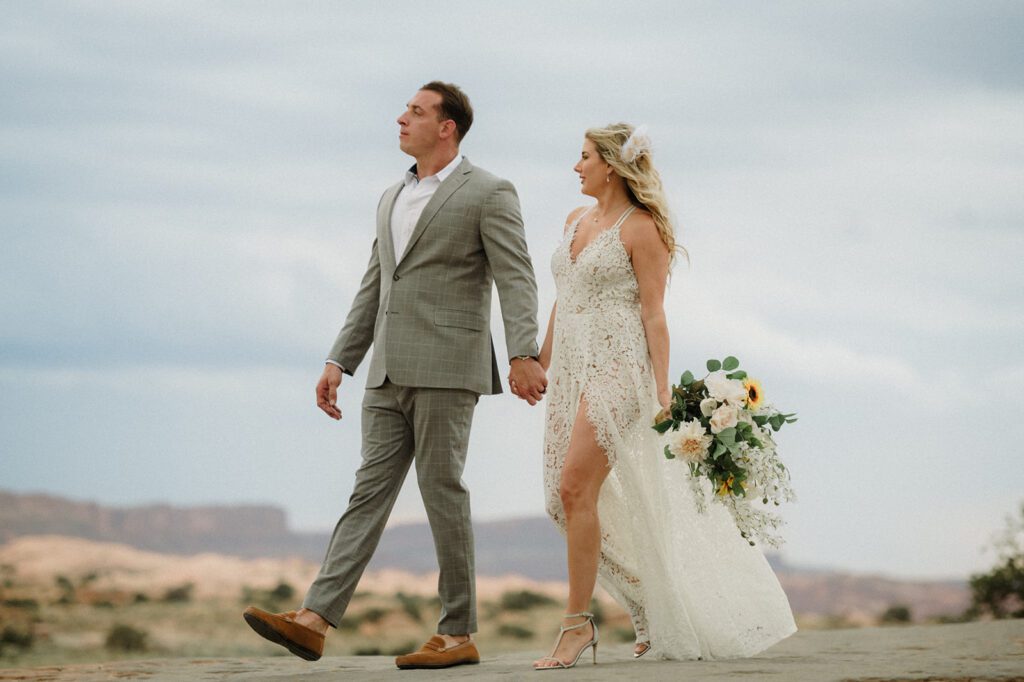 Adventure Session in Moab with bride and groom exploring.